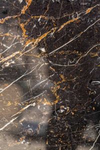 gold and white color pattern veins in stone