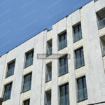 crystal white stone in facade building - side view