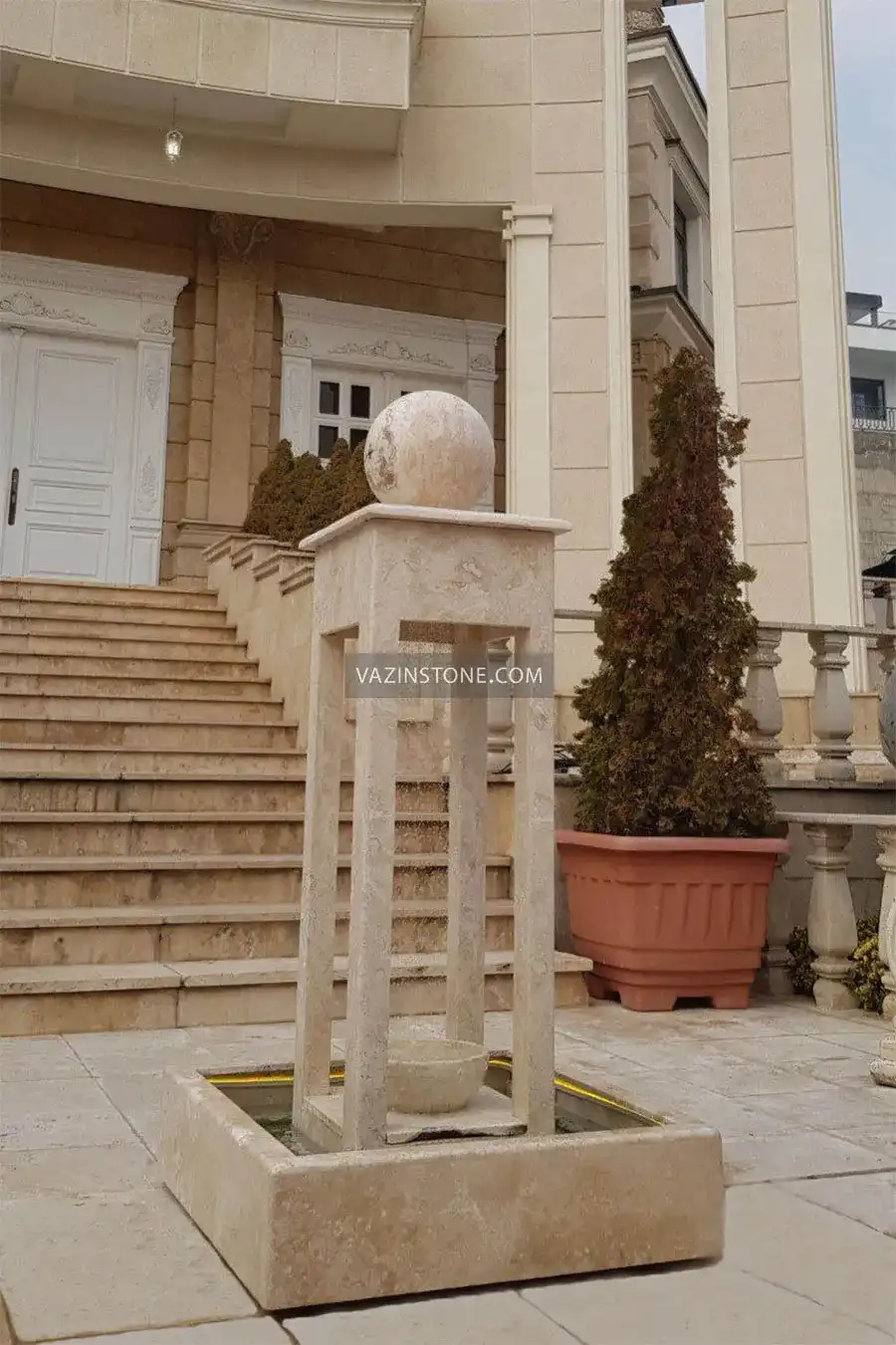 Arta stone fountain in a yard