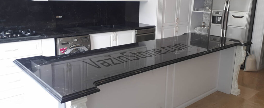 black marble countertop on cabinet island