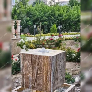 Cubic stone fountain in a courtyard