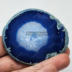 Brazilian Blue Round Agate slice in hand