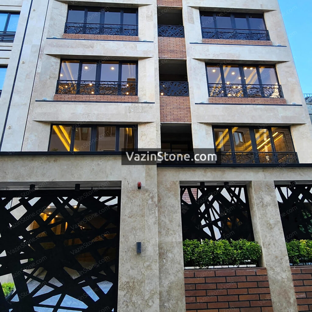 cream travertine and brick on facade
