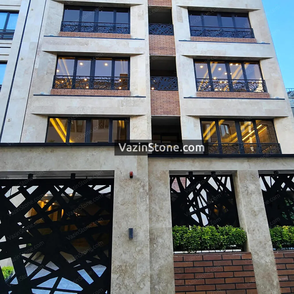 cream travertine and brick on facade