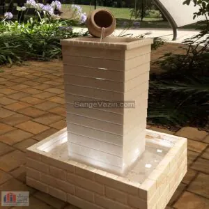 Jug stone fountain at night