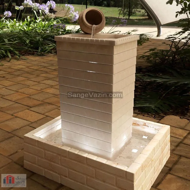 Jug stone fountain at night