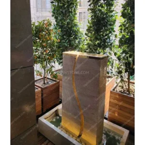 S-shaped stone fountain on a terrace