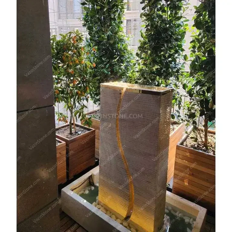 S-shaped stone fountain on a terrace