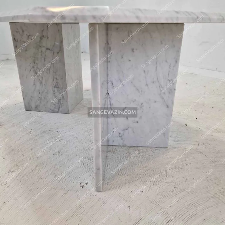 The stone bases of Vasam stone dining table