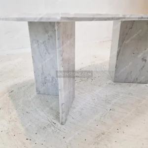The stone bases of Vasam stone dining table
