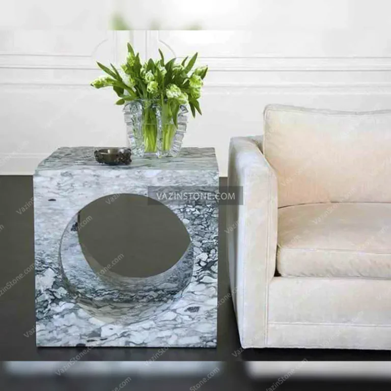 Cube stone coffee table next to the furniture