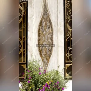 Building entrance with the design of a four-matched slab in the wall
