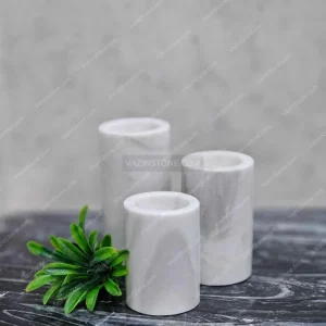 Vina stone candlestick on the stone table