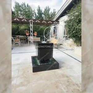 Suspended cubic stone fountain in the villa
