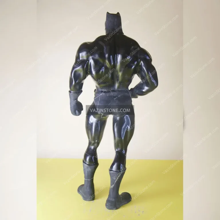 Batman stone sculpture from back