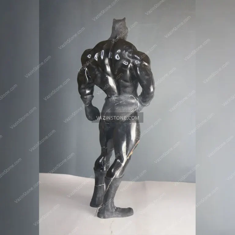 Batman stone sculpture from back