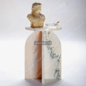 Aston stone side table with a stone sculpture