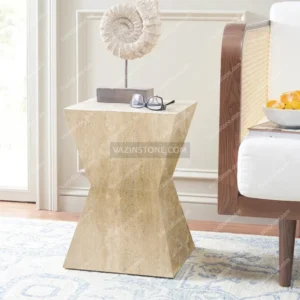 Shenisa stone side table with a decorative item