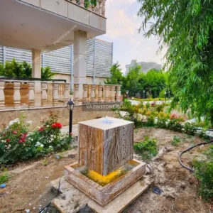 Cubic stone fountain in a courtyard Picture