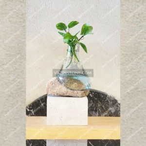 Photo of the glass and stone flower pot