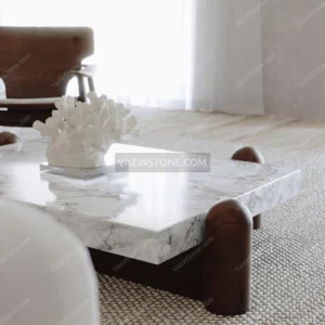 Elvera Stone Coffee Table with a decorative item