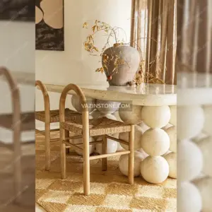 Orbita stone console table in a dining room
