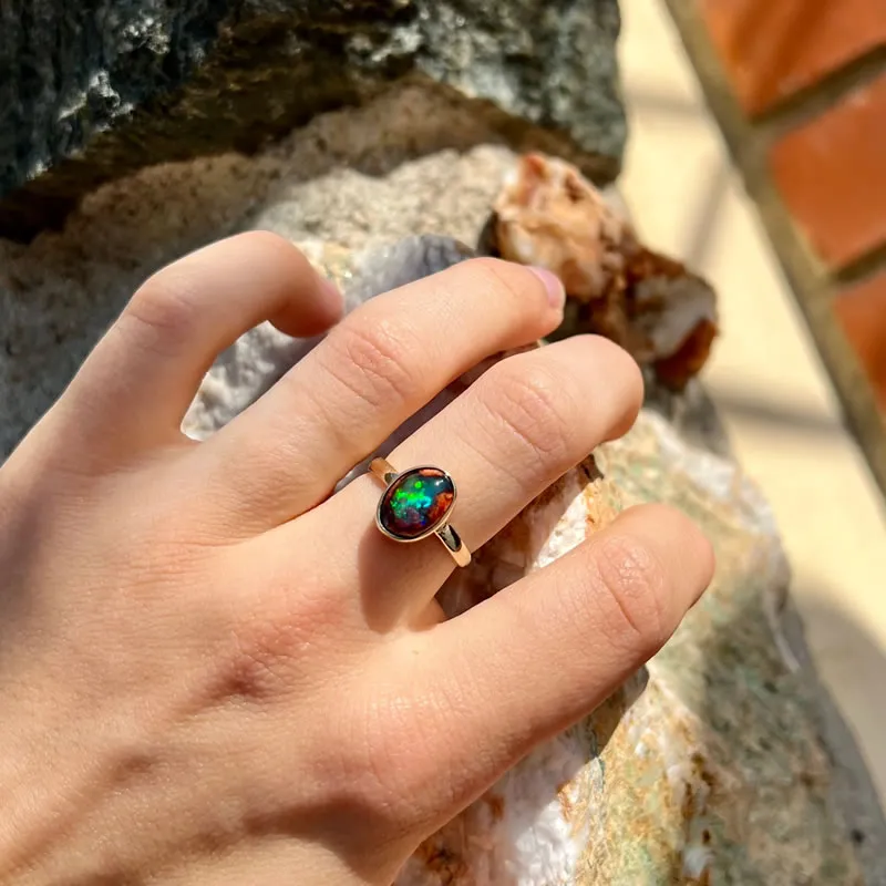 A ring with a black opal stone