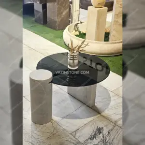 Moreno stone coffee table with a dark glass top