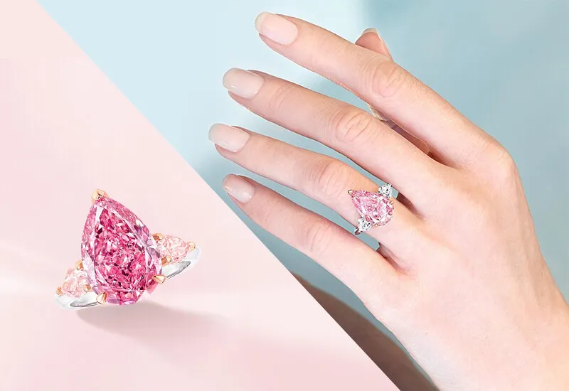 A ring with a pink diamond