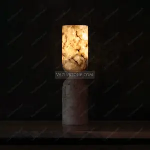 Ala stone candlestick holder with a candle