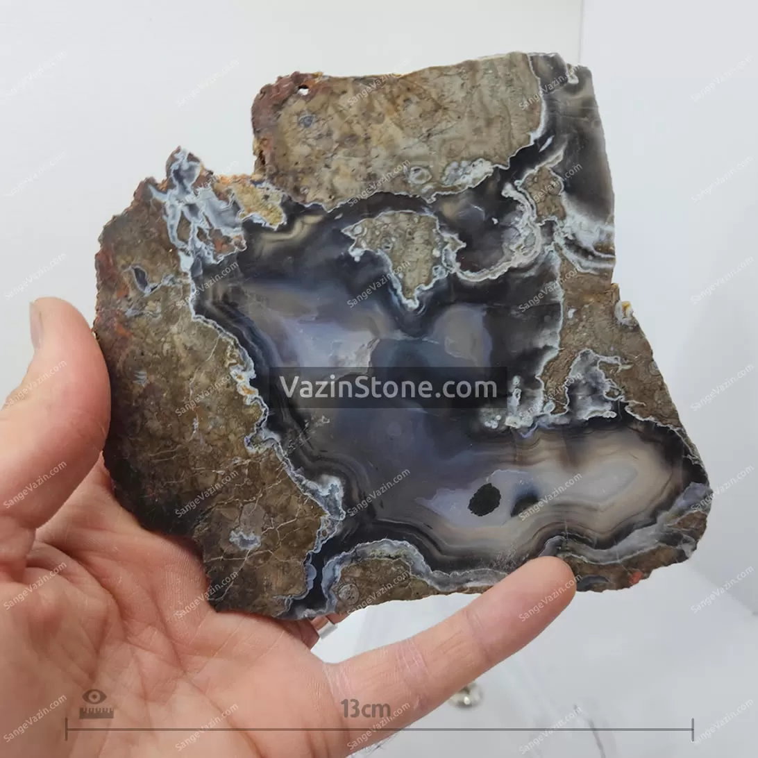 soleimani agate rough slice of iran  - scale with hand