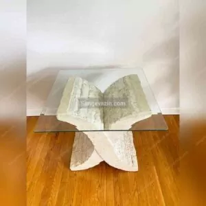 Glass top of X shaped stone table